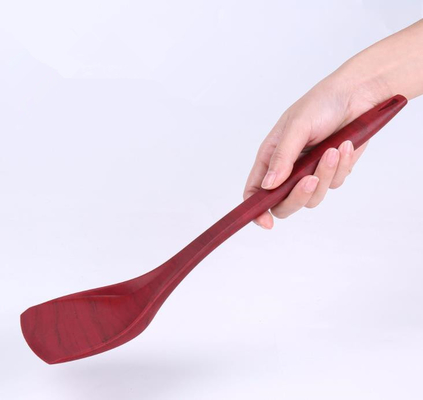A grão de madeira denomina o silicone Turner do produto comestível que cozinha ferramentas para a bandeja da Não-vara